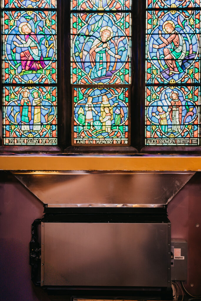 photo of heat pumps inside the chapel installed with custom woodworking